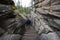 Hikers walking downstairs in the dry riverbed of a