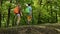 Hikers walking on forest edge - teenagers and woman backpackers
