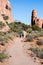Hikers walking on the scenic Devils Garden trail in Arches National Park
