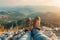 Hiking Adventure Panorama Close Up of Feet with Hiking Shoes from a Young Woman Resting on Top of a High Hill or Rock, Landscape