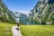 Hiking in the alps near Berchtesgaden at the Obersee, Koenigssee