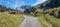 hiking area with wooden huts and view to mountain mass sulzfluh, switzerland