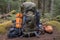 hiking backpack with tent, sleeping bag, and other gear attached