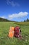 Hiking backpacker on mountain grassland