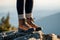 Hiking boot in mountains. Ankle boots with woolen socks