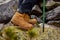 Hiking boots close-up. girl tourist steps on the mountain trail on the rocks.