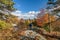 Hiking in brilliant fall foliage in the Catskill Mountain Foothills on a brilliant fall day