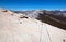 Hiking cables and High Sierras as seen from the top of Half Dome in Yosemite National Park in California USAH