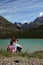 Hiking child in the Alps near lake