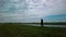 Hiking Child in Nature on cloudy day, wide shot in the Netherlands