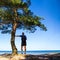 Hiking concept - man with backpack on the beach