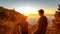 Hiking couple enjoying scenic sunrise from the Path of the Gods between Positano and Praiano on the Amalfi Coast, Campania, Italy