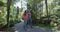 Hiking couple healthy active lifestyle in New Zealand swamp forest - Ship Creek