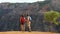 Hiking couple looking at view during hike in Waimea Canyon