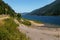 Hiking and cycling trail near alpine artificial reservoir lake Zoccolo Ultental South Tyrol Italy