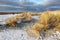 Hiking in dunes with snow