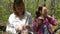 Hiking family relax sitting in the forest