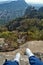 Hiking feet that is relaxed on the top of Tepozteco hill in the valley of Tepoztlan. Beautiful panoramic view of the mountains