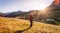 Hiking girl is enjoying the sundown in the mountains. Warm colors, alps, Austria