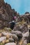 Hiking group climbing a rocky hill in Stone Forest of Imata, Arequipa, Peru