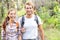 Hiking - hikers walking happy in forest