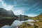 Hiking impressions along the trail from Kvalvika beach to top of mount Ryten in Lofoten Islands Norway on a blue ans