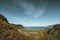 Hiking impressions along the trail from Kvalvika beach to top of mount Ryten in Lofoten Islands Norway on a blue ans