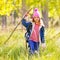 Hiking kid girl with backpack in autum poplar forest