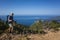 Hiking Lycian way. Man tourist is standing on path over Mediterranean sea coast on Lycian Way trail