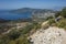 Hiking Lycian way. Man is trekking on stony path high above Mediterranean sea coast on Lycian Way trail near Kalkan