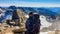 Hiking man with big backpack sitting. Scenic view on Hoher Sonnblick glacier, High Tauern mountains in Carinthia, Salzburg,