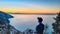 Hiking man enjoying scenic sunrise from the Path of the Gods between Positano and Praiano on the Amalfi Coast, Campania, Italy