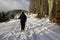 Hiking man in forest covered in snow during winter. Slovakia