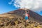 Hiking man on New Zealand Travel taking selfie at Tongariro Alpine Crossing hike trail. Happy hiker tramper phone photo