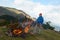 Hiking man try to light fire