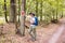 Hiking marked trail in the forest. Marking the tourist route painted on the tree. Touristic route sign. Travel route sign. Tourist