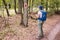 Hiking marked trail in the forest. Marking the tourist route painted on the tree. Touristic route sign. Travel route sign. Tourist