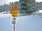 Hiking markings and orientation signs with signposts for navigating in the idyllic winter ambience above the tourist resort