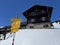 Hiking markings and orientation signs with signposts for navigating in the idyllic winter ambience of the Swiss Alps