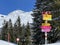 Hiking markings and orientation signs with signposts for navigating in the idyllic winter ambience of the Swiss Alps