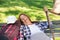 Hiking mature woman resting on bench