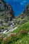 Hiking in the Monviso valleys between streams, waterfalls and flowery pastures