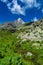 Hiking in the Monviso valleys between streams, waterfalls and flowery pastures