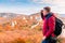 Hiking in the mountains, a traveler admiring the autumn