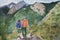 Hiking pair in the mountains, childish style watecolor illustration, AI generative image