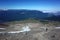 Hiking in Patagonia, Tourist walking up steep slope of volcano Puyehue, Puyehue National Park, Chile. Panoramic view