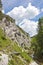 Hiking path in alpine rocky canyon