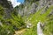 Hiking path in alpine rocky canyon