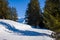 A hiking path in the middle of the mountains of the Mont Blanc massif in Europe, France, Rhone Alpes, Savoie, Alps, in winter, on