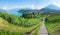 Hiking path with stairs, in the vineyard of spiez, view to lake thunersee